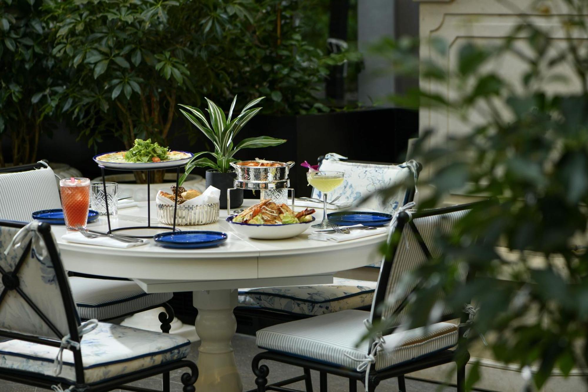 Banyan Tree Doha At La Cigale Mushaireb Ngoại thất bức ảnh A table set for afternoon tea at the Mandarin Oriental, Paris